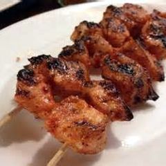 A picture of Tandoori chicken skewers.