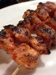 A picture of Tandoori chicken skewers.