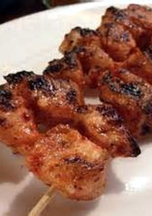 A picture of Tandoori chicken skewers.