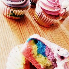 A picture of tye-dye cupcakes/cake and frosting.