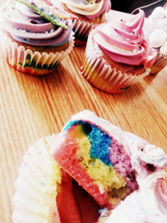 A picture of tye-dye cupcakes/cake and frosting.