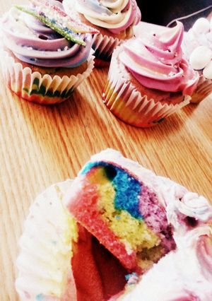 A picture of tye-dye cupcakes/cake and frosting.