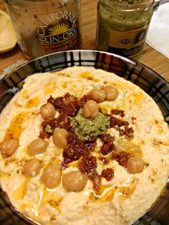 A picture of Classic hummus (sun dried tomato & pesto).