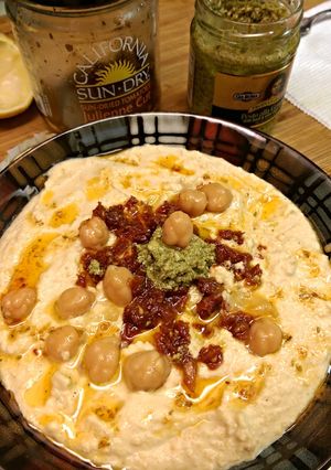 A picture of Classic hummus (sun dried tomato & pesto).
