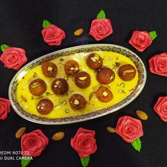 Carrot Gulab Jamun with Mango Rabri A picture of Carrot Gulab Jamun with Mango Rabri.