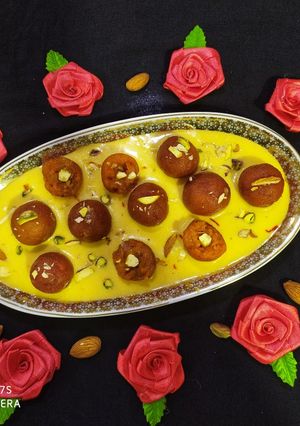 A picture of Carrot Gulab Jamun with Mango Rabri.