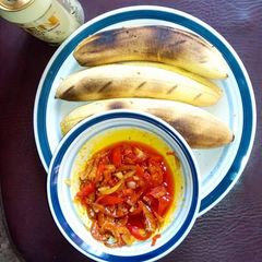 Grilled plantain with palmoil sauce A picture of Grilled plantain with palmoil sauce.