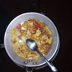Fried eggs served with ugali A picture of Fried eggs served with ugali.