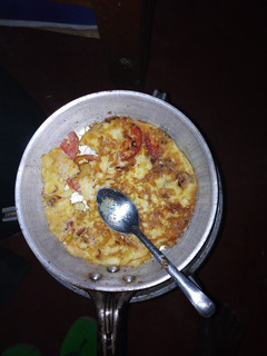 A picture of Fried eggs served with ugali.