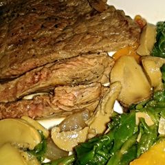 A picture of Steak and spinach saute.