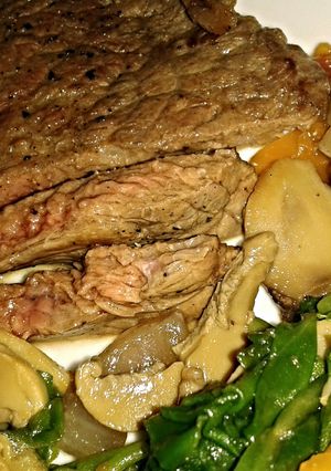 A picture of Steak and spinach saute.