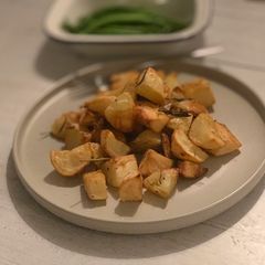 Rosemary and garlic roast potatoes A picture of Rosemary and garlic roast potatoes.