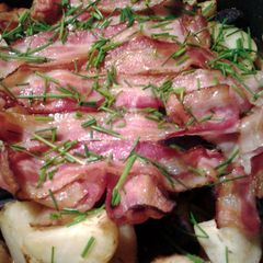 roasted potatoes and bacon A picture of roasted potatoes and bacon.