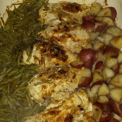 A picture of One pan chicken potatoes and green beans.