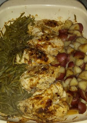 A picture of One pan chicken potatoes and green beans.