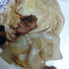 A picture of Balsamic vinegar roasted cabbage and sausage.