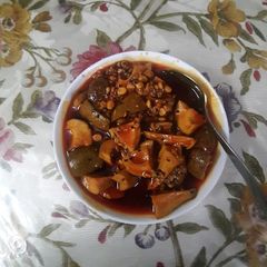 A picture of Mango pickle with garlic and chana dal.