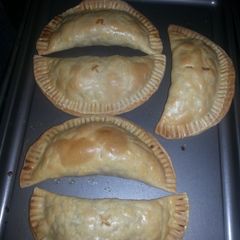 A picture of Baked chicken and Bacon empanadas.