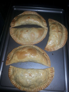 A picture of Baked chicken and Bacon empanadas.