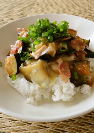 A picture of Rice Bowl with Aubergine, Bacon and Melting Cheese.