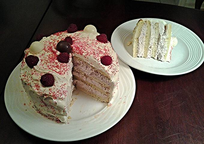 White Butter Cake layered with Raspberry Cream with a White Chocolate Frosting