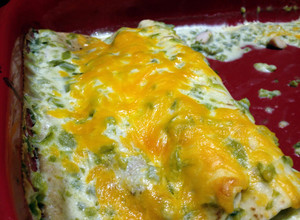 A picture of Chicken Enchiladas with Green Chile Sour Cream Sauce.