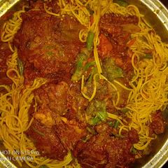 A picture of Cinnamon chicken with veggie pasta.