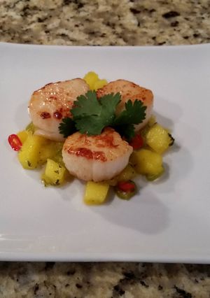 A picture of Seared Scallops with a spicy Mango salsa.