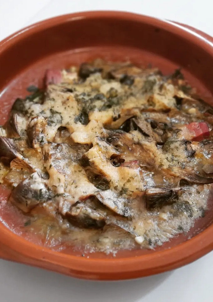 Una foto de Alcachofas con panceta al parmesano