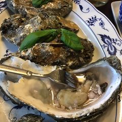 California Farm Pacific Oysters in Mignonette Dip A picture of California Farm Pacific Oysters in Mignonette Dip.