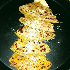A picture of Aloo Paratha with Cheese.