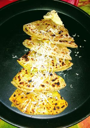 A picture of Aloo Paratha with Cheese.
