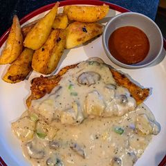 A picture of Chicken fillet with mushroom and pineapple creamy sauce.