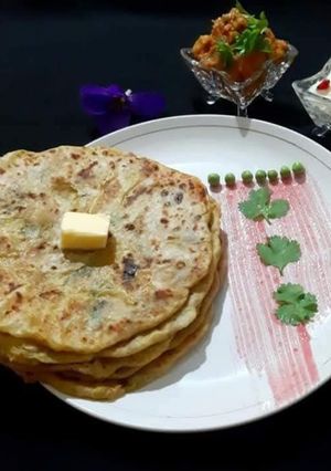 A picture of Aloo paratha with kashmiri dum aloo dum & Kesar pista shrikhand (Breakfast).