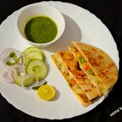 A picture of Cheesey Chole Kulche Sandwich.
