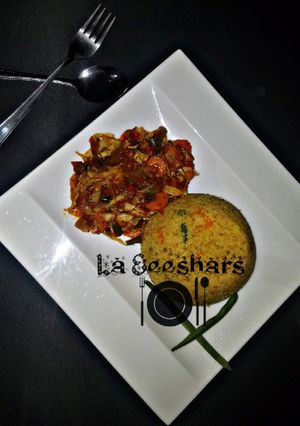 A picture of Couscous and veggies sauce.