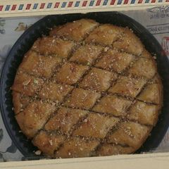 A picture of Baklava with Honey and Nuts.