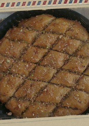 A picture of Baklava with Honey and Nuts.