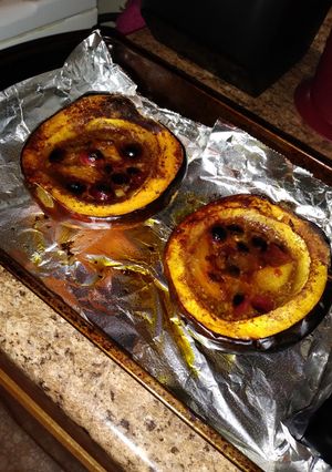 A picture of Sweet & Saucy Cranberry-Mango Baked Acorn Squash.