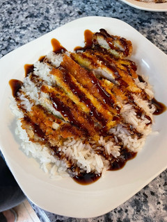 Una foto de Chuletas empanadas con salsa teriyaki