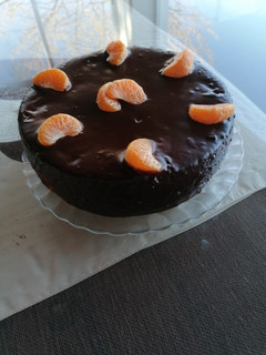Una foto de Bizcocho de naranja con cobertura de chocolate