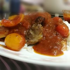 A picture of Pork Sirloin Steak With Tomato Pasta Sauce On Rice.