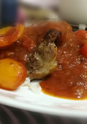 A picture of Pork Sirloin Steak With Tomato Pasta Sauce On Rice.