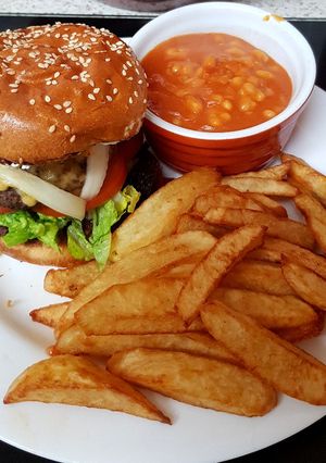 A picture of My Chilli Burger with lots of toppings 😘.
