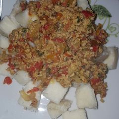 A picture of Yam cubes with egg sauce.