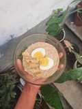 Spicey oats porridge with soft-boiled egg and fishroll