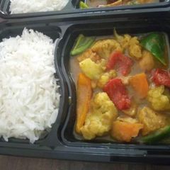 A picture of Chicken veg manchurian with rice.