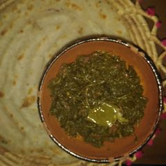 A picture of Sarson ka saag,rice(white) atta roti.