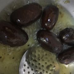 A picture of Black Gulab Jamun.