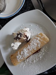 Una foto de Panqueques rellenitos de manjar
